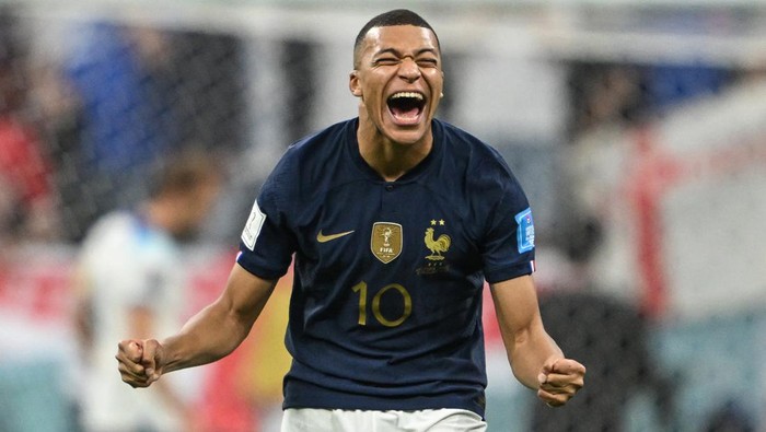 10 December 2022, Qatar, Al-Chaur: Soccer, World Cup, England - France, final round, quarterfinal, Al-Bait Stadium, Frances Kylian Mbappe laughs after missing Englands Harry Kane penalty kick. Photo: Robert Michael/dpa (Photo by Robert Michael/picture alliance via Getty Images)