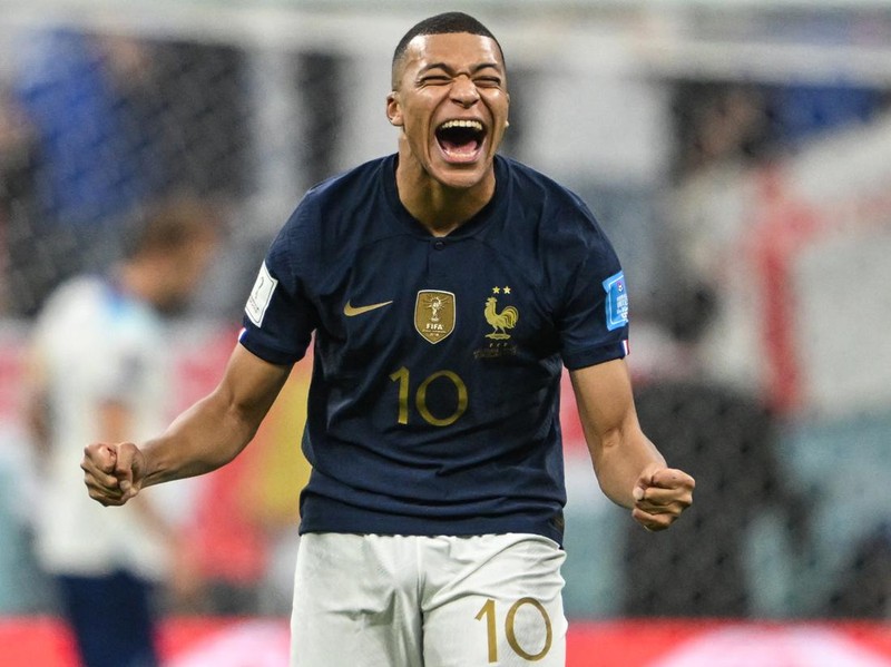10 December 2022, Qatar, Al-Chaur: Soccer, World Cup, England - France, final round, quarterfinal, Al-Bait Stadium, France's Kylian Mbappe laughs after missing England's Harry Kane penalty kick. Photo: Robert Michael/dpa (Photo by Robert Michael/picture alliance via Getty Images)