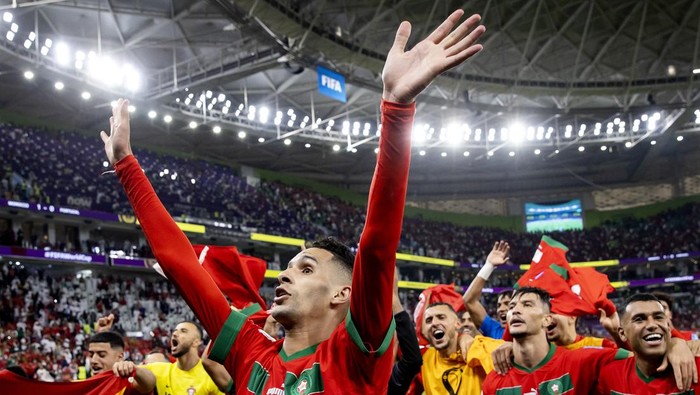 DOHA - Badr Banoune of Morocco, Achraf Dari of Morocco and Walid Cheddira of Morocco after the FIFA World Cup Qatar 2022 quarterfinal match between Morocco and Portugal at Al Thumama Stadium on December 10, 2022 in Doha, Qatar. ANP KOEN VAN WEEL (Photo by ANP via Getty Images)