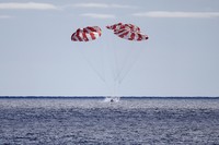 AT SEA, PACIFIC OCEAN - DECEMBER 11: NASAs Orion Capsule splashes down after a successful uncrewed Artemis I Moon Mission on December 11, 2022 seen from aboard the U.S.S. Portland in the Pacific Ocean off the coast of Baja California, Mexico. The 26-day mission took the Orion spacecraft around the moon and back, completing a historic test flight coinciding with the 50th anniversary of the landing of Apollo 17 on the moon, the last time NASA astronauts walked there. (Photo by Caroline Brehman-Pool/Getty Images)
