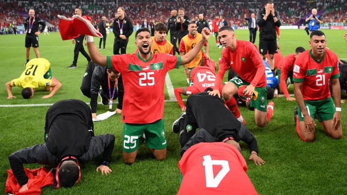 DOHA, QATAR - DECEMBER 10: Yahya Attiat-Allah of Morocco celebrates with team mates after winning the FIFA World Cup Qatar 2022 quarter final match between Morocco/Spain and Portugal/Switzerland at Al Thumama Stadium on December 10, 2022 in Doha, Qatar. (Photo by Justin Setterfield/Getty Images)