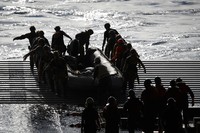 AT SEA, PACIFIC OCEAN - DECEMBER 11: U.S. Navy divers secure NASAs Orion Capsule during recovery operations after it splashed down following a successful uncrewed Artemis I moon mission on December 11, 2022 seen from aboard the U.S.S. Portland in the Pacific Ocean off the coast of Baja California, Mexico. A 26-day mission took the Orion spacecraft to the moon and back which completed a historic test flight that coincided with the 50th anniversary of the landing of Apollo 17 on the moon, the last time that NASA astronauts walked there. (Pool photo by Mario Tama/Getty Images)