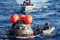 AT SEA, PACIFIC OCEAN - DECEMBER 11: U.S. Navy divers secure NASAs Orion Capsule during recovery operations after it splashed down following a successful uncrewed Artemis I moon mission on December 11, 2022 seen from aboard the U.S.S. Portland in the Pacific Ocean off the coast of Baja California, Mexico. A 26-day mission took the Orion spacecraft to the moon and back which completed a historic test flight that coincided with the 50th anniversary of the landing of Apollo 17 on the moon, the last time that NASA astronauts walked there. (Pool photo by Mario Tama/Getty Images)