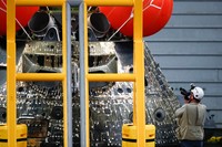 AT SEA, PACIFIC OCEAN - DECEMBER 11: U.S. Navy divers secure NASAs Orion Capsule during recovery operations after it splashed down following a successful uncrewed Artemis I moon mission on December 11, 2022 seen from aboard the U.S.S. Portland in the Pacific Ocean off the coast of Baja California, Mexico. A 26-day mission took the Orion spacecraft to the moon and back which completed a historic test flight that coincided with the 50th anniversary of the landing of Apollo 17 on the moon, the last time that NASA astronauts walked there. (Pool photo by Mario Tama/Getty Images)