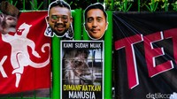 Massa koalisi membawa sejumlah poster dan spanduk aspirasi serta topeng berwajah Irfan Hakim. 