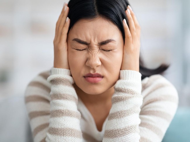 Emotional Asian Woman Covering Ears With Hands At Home, Annoyed Millennial Korean Lady Suffering Stress Or Headache, Can Not Bear Sound, Feeling Desperate And Having Nervous Breakdown, Closeup Shot