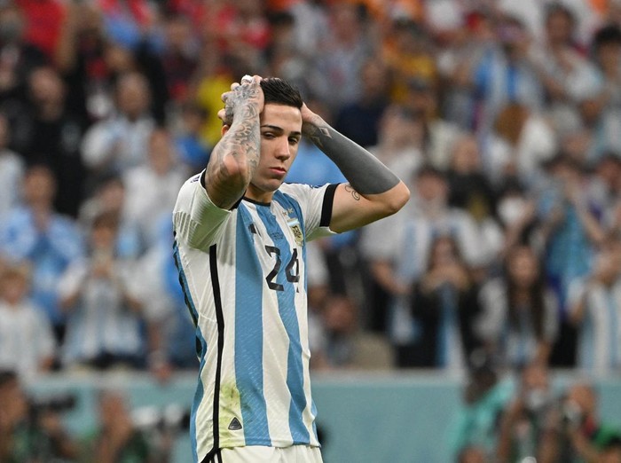 Argentina's midfielder #24 Enzo Fernandez reacts after missing his shot during the penalty shoot-out after extra-time of the Qatar 2022 World Cup quarter-final football match between Netherlands and Argentina at Lusail Stadium, north of Doha, on December 9, 2022. (Photo by Alberto PIZZOLI / AFP) (Photo by ALBERTO PIZZOLI/AFP via Getty Images)