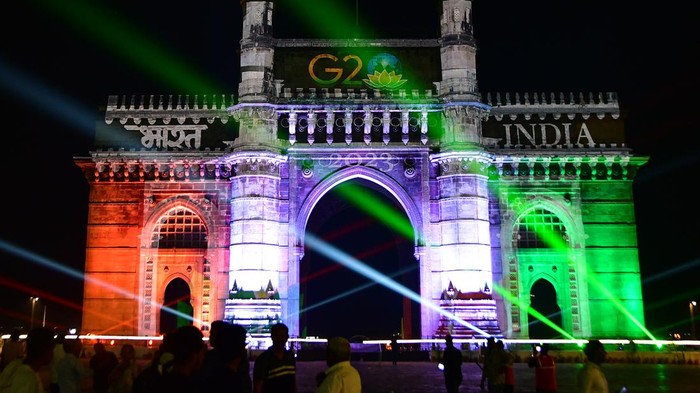 MUMBAI, INDIA - DECEMBER 12: Gateway of India illuminated with colourful lights projecting India G20 Summit logo and the country's rich cultural heritage on December 12, 2022 in Mumbai, India. India holds the presidency of the G20 from 1 December 2022 to 30 November 2023. India will be hosting G20 in almost every state and union territory, which have a huge opportunity to transform themselves. First development working group meeting in Mumbai from 13-16 December. (Photo by Bhushan Koyande/Hindustan Times via Getty Images)