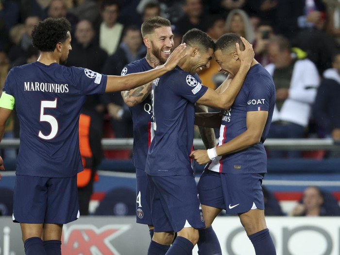 PARIS, FRANCE - OCTOBER 25: Kylian Mbappe of PSG (right) celebrates his second goal with Achraf Hakimi, Sergio Ramos, Marquinhos during the UEFA Champions League group H match between Paris Saint-Germain (PSG) and Maccabi Haifa FC at Parc des Princes stadium on October 25, 2022 in Paris, France. (Photo by Jean Catuffe/Getty Images)