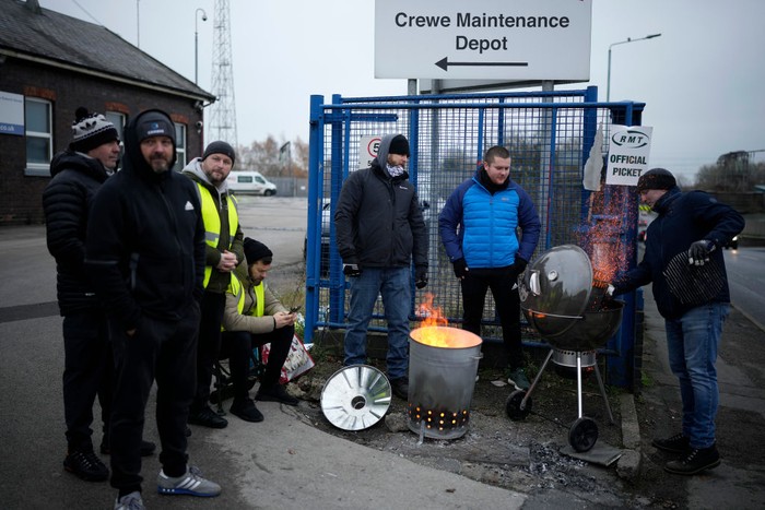 CREWE, UNITED KINGDOM- DECEMBER 13: RMT Union members picket outside Crewe rail maintenance centre as they strike over pay and working terms on December 13, 2022 in Crewe, United Kingdom. Members of the National Union of Rail, Maritime and Transport Workers (RMT) are striking across the UK in the run-up to Christmas and over the festive period holding out for a pay increase above the rate of inflation which is currently at 11%. (Photo by Christopher Furlong/Getty Images)