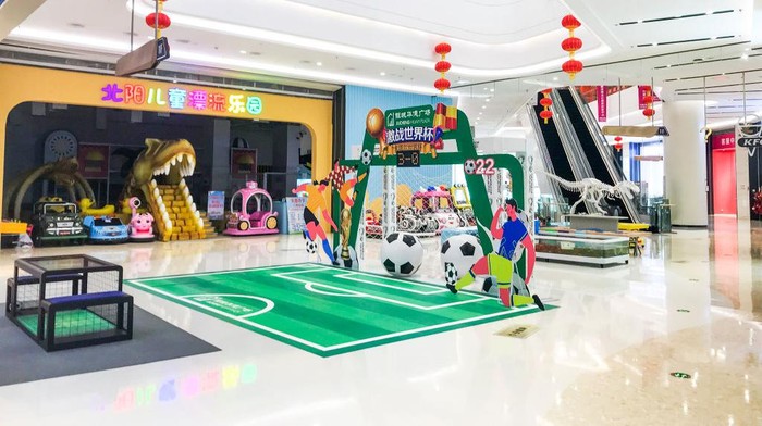 1245625104 CHANGCHUN, CHINA - DECEMBER 15, 2022 - An interactive play area specially built for the Qatar World Cup stands empty in Changchun, Jilin province, China, Dec 15, 2022. The epidemic is small in a mall empty, in addition to the normal work of the shop assistants, it is difficult to see the shadow of citizens shopping. (Photo credit should read CFOTO/Future Publishing via Getty Images)