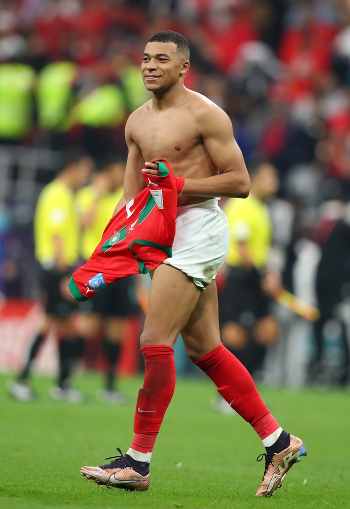 AL KHOR, QATAR - DECEMBER 14: Kylian Mbappe of France with the trikot of Achraf Hakimi of Morocco after the FIFA World Cup Qatar 2022 semi final match between France and Morocco at Al Bayt Stadium on December 14, 2022 in Al Khor, Qatar. (Photo by Stefan Matzke - sampics/Corbis via Getty Images)