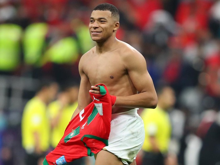 AL KHOR, QATAR - DECEMBER 14: Kylian Mbappe of France with the trikot of Achraf Hakimi of Morocco after the FIFA World Cup Qatar 2022 semi final match between France and Morocco at Al Bayt Stadium on December 14, 2022 in Al Khor, Qatar. (Photo by Stefan Matzke - sampics/Corbis via Getty Images)