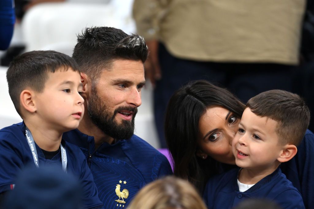 France's forward #09 Olivier Giroud sits with his wife Jennifer after the Qatar 2022 World Cup Group D football match between Tunisia and France at the Education City Stadium in Al-Rayyan, west of Doha on November 30, 2022. (Photo by FRANCK FIFE / AFP) (Photo by FRANCK FIFE/AFP via Getty Images)