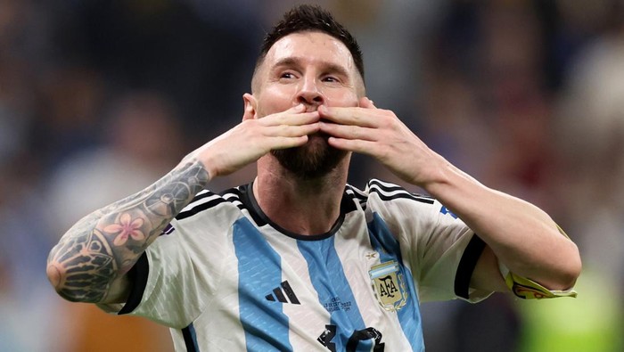 LUSAIL CITY, QATAR - DECEMBER 13: Lionel Messi celebrates after their sides third goal by Julian Alvarez of Argentina (not pictured) during the FIFA World Cup Qatar 2022 semi final match between Argentina and Croatia at Lusail Stadium on December 13, 2022 in Lusail City, Qatar. (Photo by Clive Brunskill/Getty Images)