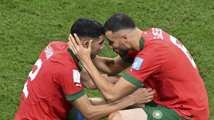 AL KHOR, QATAR - DECEMBER 14: Players of Morocco console each other after France won the FIFA World Cup Qatar 2022 semi final match against Morocco at Al Bayt Stadium on December 14, 2022 in Al Khor, Qatar. France beat Morocco 2-0, to face Argentina in 2022 FIFA World Cup final. (Photo by Ercin Erturk/Anadolu Agency via Getty Images)
