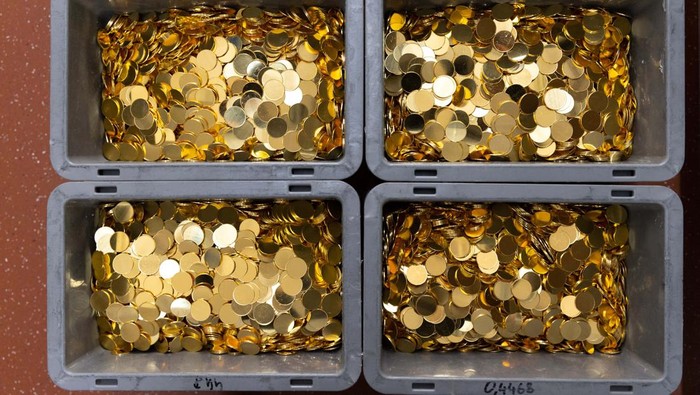A stack of quarter-ounce gold coins is seen in the factory of the Austrian Mint in Vienna, Austria, December 13, 2022. REUTERS/Lisa Leutner
