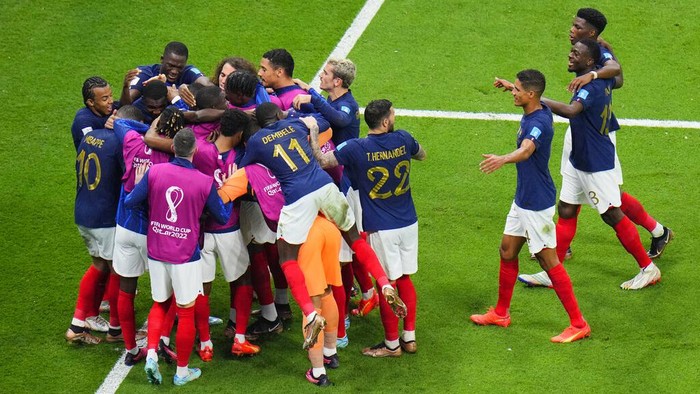 French players celebrate during the World Cup semifinal soccer match between France and Morocco at the Al Bayt Stadium in Al Khor, Qatar, Wednesday, Dec. 14, 2022. (AP Photo/Hassan Ammar)