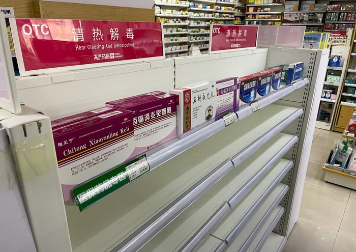 This photo shows an almost empty shelf of cold medicine at a pharmacy amid the Covid-19 pandemic in Beijing on December 15, 2022. (Photo by Yuxuan ZHANG / AFP) (Photo by YUXUAN ZHANG/AFP via Getty Images)