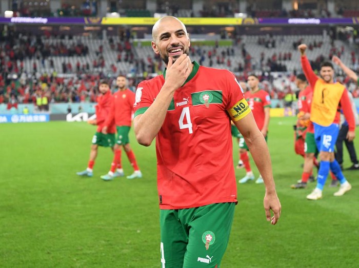 DOHA, QATAR - DECEMBER 10: Sofyan Amrabat of Morocco celebrates at the end of the FIFA World Cup Qatar 2022 quarter final match between Morocco/Spain and Portugal/Switzerland at Al Thumama Stadium on December 10, 2022 in Doha, Qatar. (Photo by Mike Hewitt - FIFA/FIFA via Getty Images)