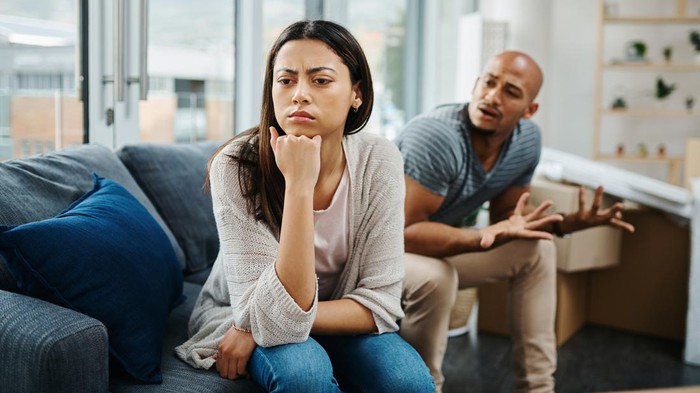 Shot of a young woman looking upset after a fight with her partner at home
