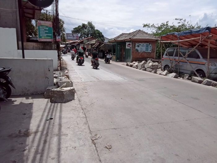 Jl Pabuaran di Kabupaten Bogor yang sudah diperbaiki. (Dok PUPR Kabupaten Bogor)