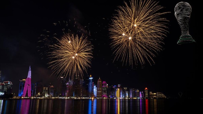 DOHA, QATAR - DECEMBER 15: Fireworks and drones light up the sky during the FIFA World Cup 2022 on December 15, 2022 in Doha, Qatar. (Photo by Lionel Hahn/Getty Images)