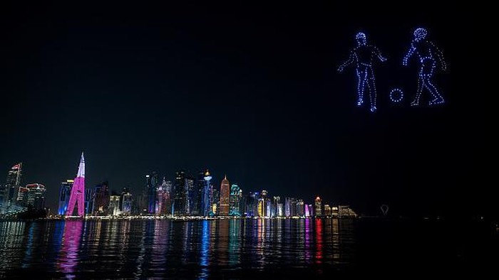 DOHA, QATAR - DECEMBER 15: Fireworks and drones light up the sky during the FIFA World Cup 2022 on December 15, 2022 in Doha, Qatar. (Photo by Lionel Hahn/Getty Images)