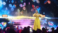 Raisa tampil mengenakan gaun berwarna kuning. Foto: Ari Saputra/detikcom