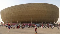 Lusail Iconic Stadium terletak di Kota Lusail, Qatar. Berada sekitar 20 kilometer (12 mi) di sebelah utara Doha. James Williamson/AMA/Getty Images.