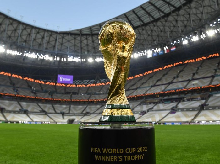LUSAIL CITY, QATAR - DECEMBER 14: The World Cup trophy pictured inside Lusail Stadium on December 14, 2022 in Lusail City, Qatar. (Photo by David Ramos - FIFA/FIFA via Getty Images)USAGE INSTRUCTIONSThe FIFA World Cup Winners trophy is FIFA’s IP and use of this images must be approved by FIFA.  Furthermore, all uses and publications of this image must not crop the plinth, the designation on the plinth must remain fully legible.