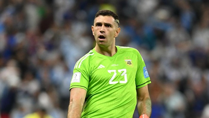 LUSAIL CITY, QATAR - DECEMBER 18: Emiliano Martinez of Argentina celebrates as Aurelien Tchouameni of France misses the teams third penalty in the penalty shoot out during the FIFA World Cup Qatar 2022 Final match between Argentina and France at Lusail Stadium on December 18, 2022 in Lusail City, Qatar. (Photo by David Ramos - FIFA/FIFA via Getty Images)