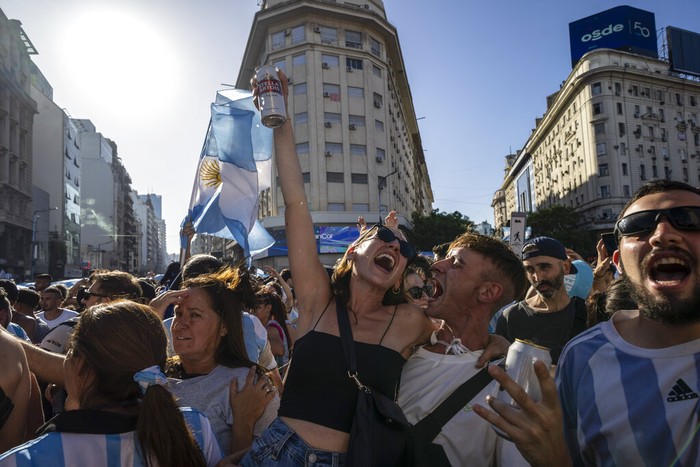 Argentine soccer fans react to France scoring a goal during the World Cup final soccer match between Argentina and France in Buenos Aires, Argentina, Sunday, Dec. 18, 2022. (AP Photo/Rodrigo Abd)