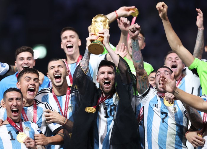 LUSAIL CITY, QATAR - DECEMBER 18: Lionel Messi of Argentina lifts the FIFA World Cup Qatar 2022 Winners Trophy during the FIFA World Cup Qatar 2022 Final match between Argentina and France at Lusail Stadium on December 18, 2022 in Lusail City, Qatar. (Photo by Julian Finney/Getty Images)