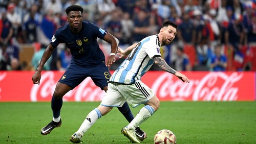 LUSAIL CITY, QATAR - DECEMBER 18: Lionel Messi of Argentina competes for the ball with Aurelien Tchouameni of France ,during the FIFA World Cup Qatar 2022 Final match between Argentina and France at Lusail Stadium on December 18, 2022 in Lusail City, Qatar. (Photo by MB Media/Getty Images)