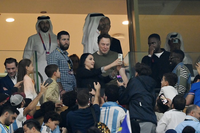 LUSAIL CITY, QATAR - DECEMBER 18: Fans take photos with Elon Musk during the FIFA World Cup Qatar 2022 Final match between Argentina and France at Lusail Stadium on December 18, 2022 in Lusail City, Qatar. (Photo by Dan Mullan/Getty Images)