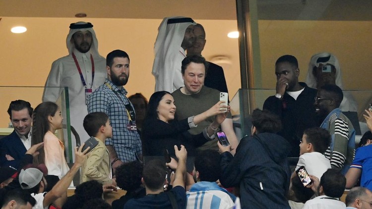 LUSAIL CITY, QATAR - DECEMBER 18: Fans take photos with Elon Musk during the FIFA World Cup Qatar 2022 Final match between Argentina and France at Lusail Stadium on December 18, 2022 in Lusail City, Qatar. (Photo by Dan Mullan/Getty Images)