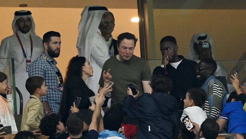 LUSAIL CITY, QATAR - DECEMBER 18: Fans take photos with Elon Musk during the FIFA World Cup Qatar 2022 Final match between Argentina and France at Lusail Stadium on December 18, 2022 in Lusail City, Qatar. (Photo by Dan Mullan/Getty Images)