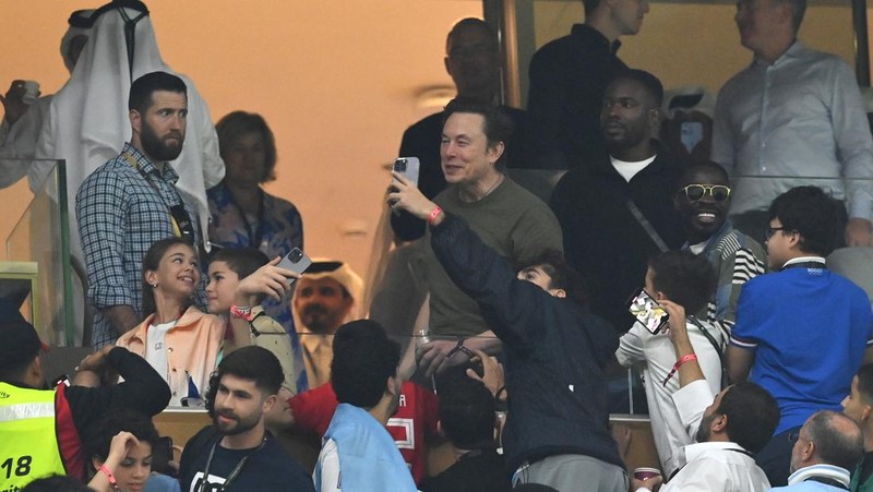 LUSAIL CITY, QATAR - DECEMBER 18: Fans take photos with Elon Musk during the FIFA World Cup Qatar 2022 Final match between Argentina and France at Lusail Stadium on December 18, 2022 in Lusail City, Qatar. (Photo by Dan Mullan/Getty Images)