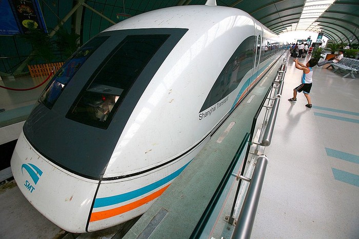 SHANGHAI, CHINA - JULY 24: (CHINA OUT) A boy plays on the platform beside an idle maglev train at a train station on July 24, 2006 in Shanghai, China. According to state media released on June 9, China may abandon the construction of the 4-billion-euro Shanghai-Hangzhou high-speed maglev line if talks with Germany on technical transfers and other issues fail. The Shanghai-Hangzhou maglev line will be the world's second commercial high-speed maglev track. Shanghai operates the world's only commercial maglev system on a 48.3-mile run between Shanghai's financial district and its Pudong airport. (Photo by China Photos/Getty Images)