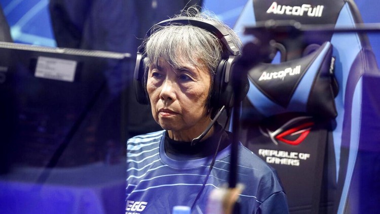 Chiang Yi-Shu watches the screen during the competition at Hungkuang University in Taichung, Taiwan on Saturday, Dec. 17, 2022.Chiang is one of the League of Legends players on Hungkung Evergreen Gamings team, established this summer. The team, whose members range from 62 to 69 years old, was founded by Huang Jianji, the director of the department of Multimedia Game development and application of Hungkuang University. They competed in their first-ever video game tournament Saturday at the university. (AP photo/I-Hwa Cheng)