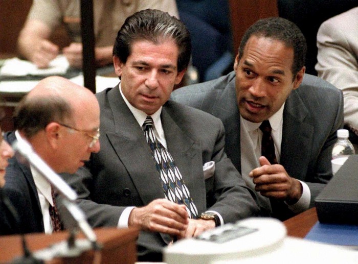 LOS ANGELES, CA - MAY 3:  This 03 May, 1995 file photo shows murder defendant O.J. Simpson (R) consulting with friend Robert Kardashian (C) and Alvin Michelson (L), the attorney representing Kardashian, during a hearing in Los Angeles.  It was announced 02 October, 2003 that Kardashian, a businessman and lawyer who was a key figure in the O.J. Simpson saga and part of his legal 