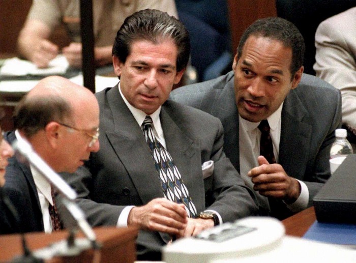 52034818 LOS ANGELES, CA - MAY 3: This 03 May, 1995 file photo shows murder defendant O.J. Simpson (R) consulting with friend Robert Kardashian (C) and Alvin Michelson (L), the attorney representing Kardashian, during a hearing in Los Angeles. It was announced 02 October, 2003 that Kardashian, a businessman and lawyer who was a key figure in the O.J. Simpson saga and part of his legal