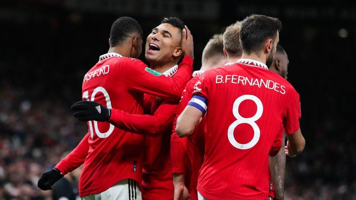 MANCHESTER, ENGLAND - DECEMBER 21: Marcus Rashford of Manchester United celebrates with Casemiro after scoring his sides second goal during the Carabao Cup Fourth Round match between Manchester United and Burnley at Old Trafford on December 21, 2022 in Manchester, England. (Photo by James Gill - Danehouse/Getty Images)
