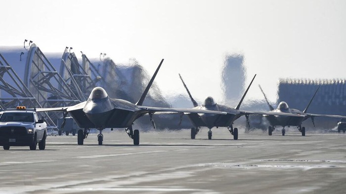In this photo provided by South Korean Defense Ministry, A U.S. B-52 bomber, C-17 and South Korean Air Force F-35 fighter jets fly over the Korean Peninsula during a joint air drill in South Korea, Tuesday, Dec. 20, 2022. The United States flew nuclear-capable bombers and advanced stealth jets in a show of force against North Korea on Tuesday, as the powerful sister of North Korean leader Kim Jong Un derided doubts about her country's military and threatened a full-range intercontinental ballistic missile test. (South Korean Defense Ministry via AP)
