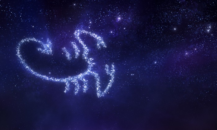 Scorpio zodiac sign on space background