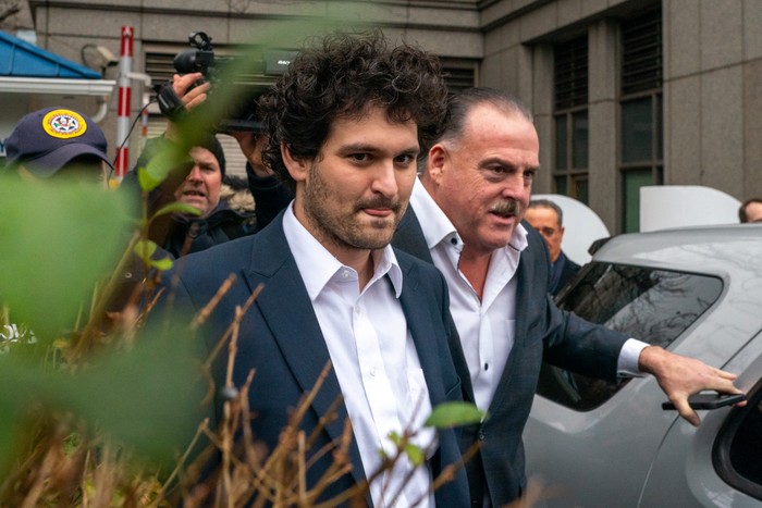 NEW YORK, NY - DECEMBER 22: FTX founder Sam Bankman-Fried leaves Manhattan Federal Court after his arraignment and bail hearings on December 22, 2022 in New York City. Bankman-Fried, who was indicted on December 9th and arrested 3 days later by Bahamas law enforcement at the request of U.S. prosecutors, consented to extradition to the U.S. where he is facing eight criminal counts of fraud, conspiracy and money-laundering offenses which includes making illegal political contributions. He is potentially facing life in prison if convicted.  He was released on $250 million bond with the bail package requiring him to stay with his parents in California. (Photo by David Dee Delgado/Getty Images)