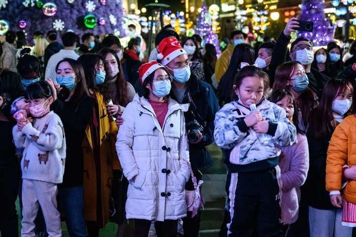 1245812579 GUANGZHOU, CHINA - DECEMBER 24: People gather ahead of the Christmas day and as the new year approaches, in Guangzhou, China on December 24, 2022. (Photo by Stringer/Anadolu Agency via Getty Images)