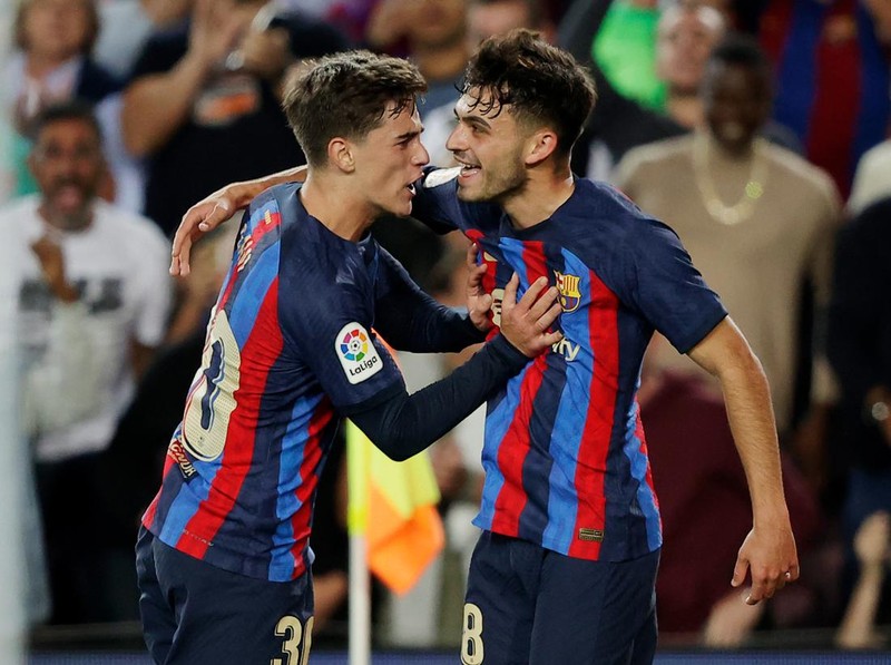 BARCELONA, SPAIN - OCTOBER 9: Pedri Gonzalez of FC Barcelona celebrating 2-0 with Gavi of FC Barcelona  during the La Liga Santander  match between FC Barcelona v Celta de Vigo at the Spotify Camp Nou on October 9, 2022 in Barcelona Spain (Photo by David S. Bustamante/Soccrates/Getty Images)