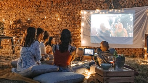 Photo of friends at backyard movie night.
